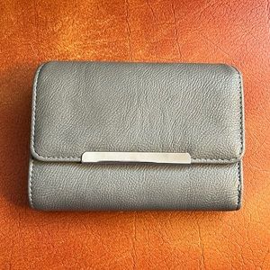Safe Keeper brand gray, sleek women’s wallet. Excellent condition.